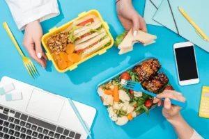 cropped view of two women holding forks over lunch 2024 11 10 19 17 46 utc
